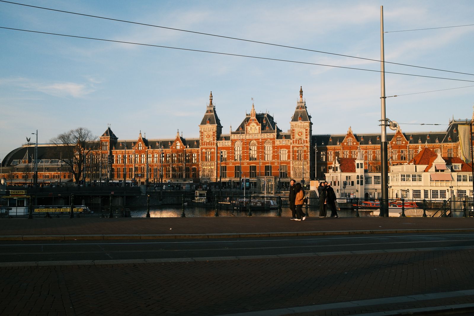 Brick gables and the Dom tower rising over a car-free street in central Utrecht